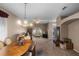 Bright living room and dining area with chandelier, comfortable seating, and a large window at 1868 Rachels Ridge Loop # L, Ocoee, FL 34761