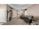 Cozy living room with neutral walls, carpet, chandelier and dining room furniture set at 1868 Rachels Ridge Loop # L, Ocoee, FL 34761