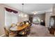 Inviting living area featuring dining table and chairs, cozy seating, and ample natural light at 1868 Rachels Ridge Loop # L, Ocoee, FL 34761