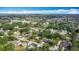 Scenic aerial view of a quiet neighborhood with lush trees and a small pond at 1901 Rose Blvd, Orlando, FL 32839