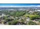 Aerial view features the neighborhood's lush green canopy and nearby conveniences at 1901 Rose Blvd, Orlando, FL 32839