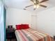 Comfortable bedroom featuring a ceiling fan, hardwood floors, and soft natural light at 1901 Rose Blvd, Orlando, FL 32839