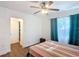 Bright bedroom featuring hardwood floors, a ceiling fan, and natural light at 1901 Rose Blvd, Orlando, FL 32839