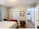 A relaxing bedroom with wood floors, ensuite bathroom, closet, and a picture window at 1901 Rose Blvd, Orlando, FL 32839