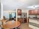 Open-concept dining area and kitchen featuring modern appliances and countertops at 1901 Rose Blvd, Orlando, FL 32839
