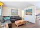 Inviting living room featuring a sectional sofa, hardwood floors, and artwork at 1901 Rose Blvd, Orlando, FL 32839