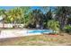 Backyard featuring an in-ground pool surrounded by lush landscaping at 1901 Rose Blvd, Orlando, FL 32839