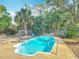 Backyard with inviting in-ground pool, mature trees, and privacy fence at 1901 Rose Blvd, Orlando, FL 32839