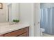 Bathroom showcasing a white vanity with an undermount sink, a large mirror, and silver fixtures at 2167 Pearl Cider St, Orlando, FL 32824