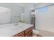 Bathroom featuring a white vanity with an oval sink and a combined tub and shower with tile surround at 2167 Pearl Cider St, Orlando, FL 32824