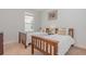 Charming bedroom featuring two twin beds with matching wooden frames and a neutral color scheme at 2167 Pearl Cider St, Orlando, FL 32824