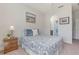 Comfortable bedroom featuring an arched doorway leading to the bathroom at 2167 Pearl Cider St, Orlando, FL 32824