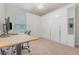 A bright bedroom featuring white closets and a carpeted floor at 2167 Pearl Cider St, Orlando, FL 32824