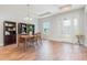 Bright dining room with wood floors and a charming chandelier at 2167 Pearl Cider St, Orlando, FL 32824