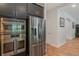 Modern kitchen featuring stainless steel appliances and sleek cabinetry with stylish tile floors at 2167 Pearl Cider St, Orlando, FL 32824