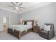 Serene main bedroom with plush carpeting, tray ceiling, and neutral decor at 2167 Pearl Cider St, Orlando, FL 32824