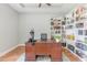 Spacious office with a large desk, hardwood floors and custom built-in bookshelves at 2167 Pearl Cider St, Orlando, FL 32824