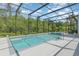 Inviting screened-in pool with a spa offers a private outdoor retreat at 2167 Pearl Cider St, Orlando, FL 32824