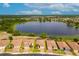Aerial shot capturing a community with a scenic lake, emphasizing the neighborhood's setting and proximity to nature at 2173 Lake Side Ave, Davenport, FL 33837