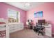 Cheerful pink bedroom with a bunk bed, white dresser, and natural light at 2173 Lake Side Ave, Davenport, FL 33837