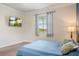 Bright bedroom featuring a TV, large window, and plush carpet at 2173 Lake Side Ave, Davenport, FL 33837
