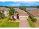 Stunning lakefront home featuring a beautiful tile roof and meticulously manicured landscaping at 2173 Lake Side Ave, Davenport, FL 33837