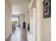 Hallway with wood floors leading to the living room and offering lake views at 2173 Lake Side Ave, Davenport, FL 33837