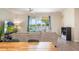 Cozy living room with a large sliding glass doors to the lanai and waterfront views beyond at 2173 Lake Side Ave, Davenport, FL 33837