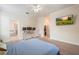 Spacious main bedroom with a tv, walk-in closet and attached bathroom at 2173 Lake Side Ave, Davenport, FL 33837