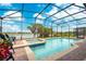 Gorgeous screened-in pool and spa with beautiful lake views at 2173 Lake Side Ave, Davenport, FL 33837