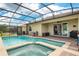 Beautiful in-ground screened pool and spa with fountains and lake views at 2173 Lake Side Ave, Davenport, FL 33837