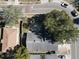 Birds-eye view of home featuring a dark gray roof, neighboring properties and adjacent street at 2212 Atrium Cir, Orlando, FL 32808