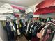 Walk-in closet featuring wire shelving and a hanging rod, packed with assorted clothing and accessories at 2212 Atrium Cir, Orlando, FL 32808