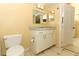 Clean bathroom featuring a white vanity with cabinets, and decorative tile flooring at 2214 Metropolitan Way # 1032, Orlando, FL 32839