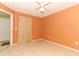 Bedroom with tile flooring, neutral walls, and a ceiling fan at 2214 Metropolitan Way # 1032, Orlando, FL 32839