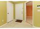 Bright foyer featuring tile floors, a door with a mat, and easy access to the home at 2214 Metropolitan Way # 1032, Orlando, FL 32839