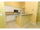Kitchen with white cabinetry, granite countertops, and modern appliances at 2214 Metropolitan Way # 1032, Orlando, FL 32839