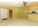 Open living room area features tiled flooring, neutral walls, and a modern ceiling fan at 2214 Metropolitan Way # 1032, Orlando, FL 32839