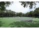 Well-maintained tennis courts surrounded by mature trees offer residents an active lifestyle option at 2214 Metropolitan Way # 1032, Orlando, FL 32839