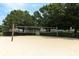 Community sand volleyball court with net set up and green foliage surrounding the play area at 2214 Metropolitan Way # 1032, Orlando, FL 32839