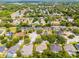 Neighborhood aerial view features mature trees surrounding the property and neighboring homes at 224 Bluestone Pl, Casselberry, FL 32707