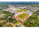 Beautiful aerial view of community featuring school, baseball field, track, and tennis courts at 224 Bluestone Pl, Casselberry, FL 32707