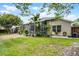 Spacious backyard features mature landscaping, screened in patio and ample seating at 224 Bluestone Pl, Casselberry, FL 32707