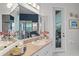 Bathroom featuring a large mirror, vanity with sink, and tiled shower area at 224 Bluestone Pl, Casselberry, FL 32707
