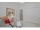 Simple bedroom with a comfortable chair, painting, and plenty of closet space at 224 Bluestone Pl, Casselberry, FL 32707