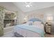 Comfortable bedroom with bright floral accents, and natural light from the window with backyard views at 224 Bluestone Pl, Casselberry, FL 32707