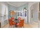 Cozy dining room featuring a glass table, unique chairs, and a built-in display cabinet at 224 Bluestone Pl, Casselberry, FL 32707