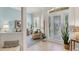 Light-filled foyer features decorative glass front door, tile floors, and seating area with plants at 224 Bluestone Pl, Casselberry, FL 32707