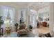 Inviting foyer with large windows, natural light, and a view into the dining room at 224 Bluestone Pl, Casselberry, FL 32707