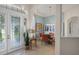 Inviting foyer leads to dining room showcasing tile flooring and a modern chandelier at 224 Bluestone Pl, Casselberry, FL 32707